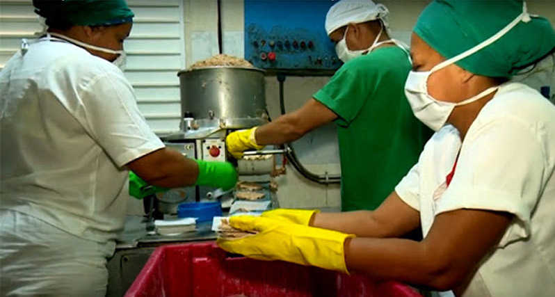Workers at a meat company in Holguín.