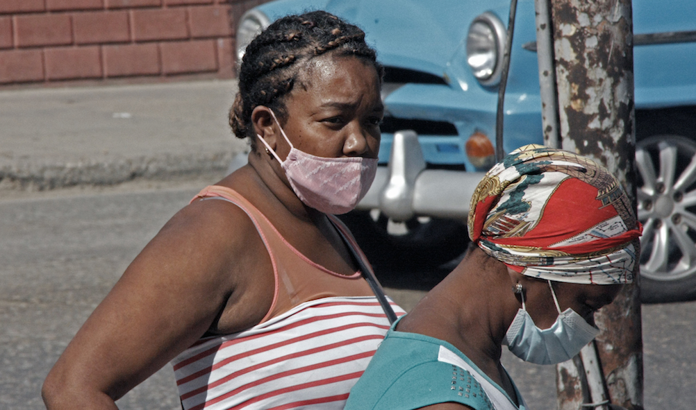 Two women protected against Covid-19 in Havana.