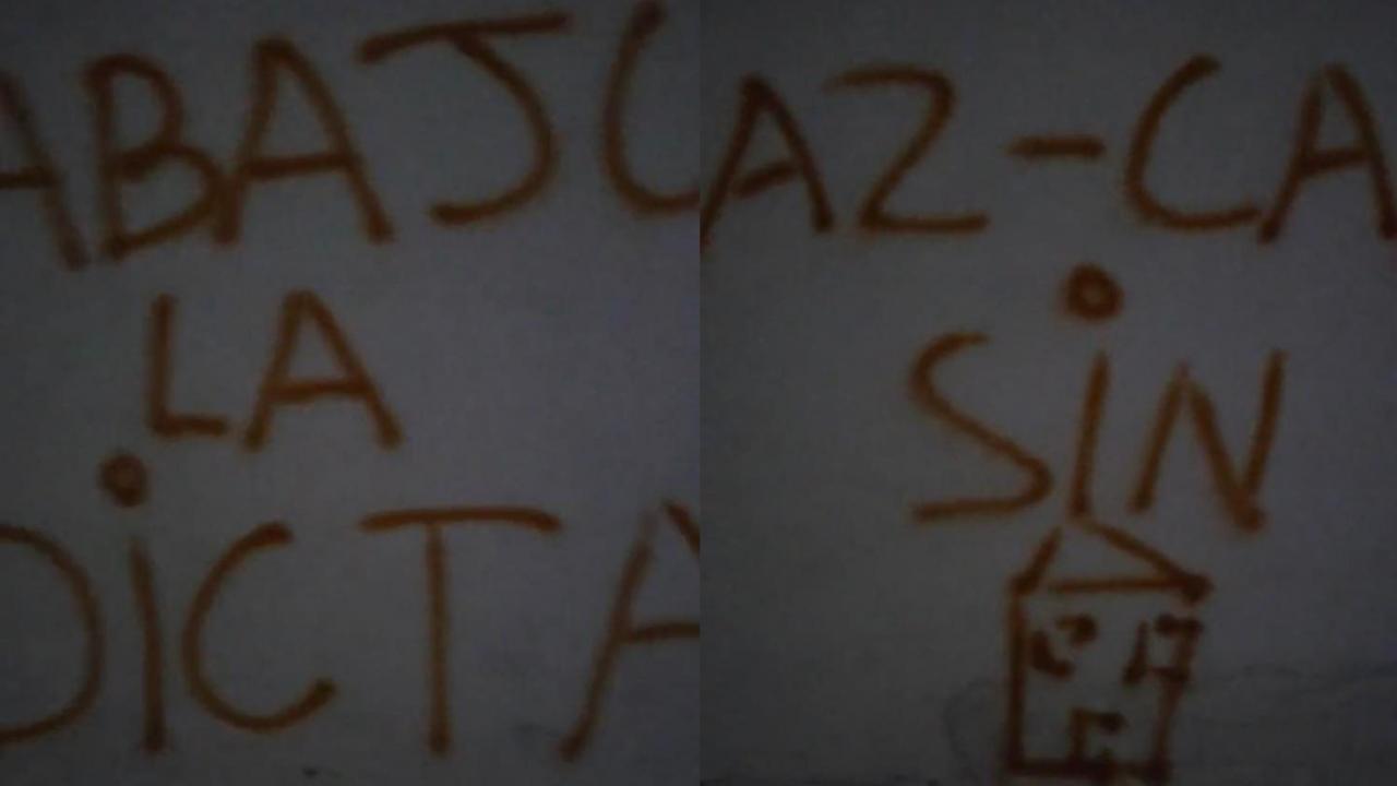 Fragmentos de los carteles pintados en un muro de Santa Clara.