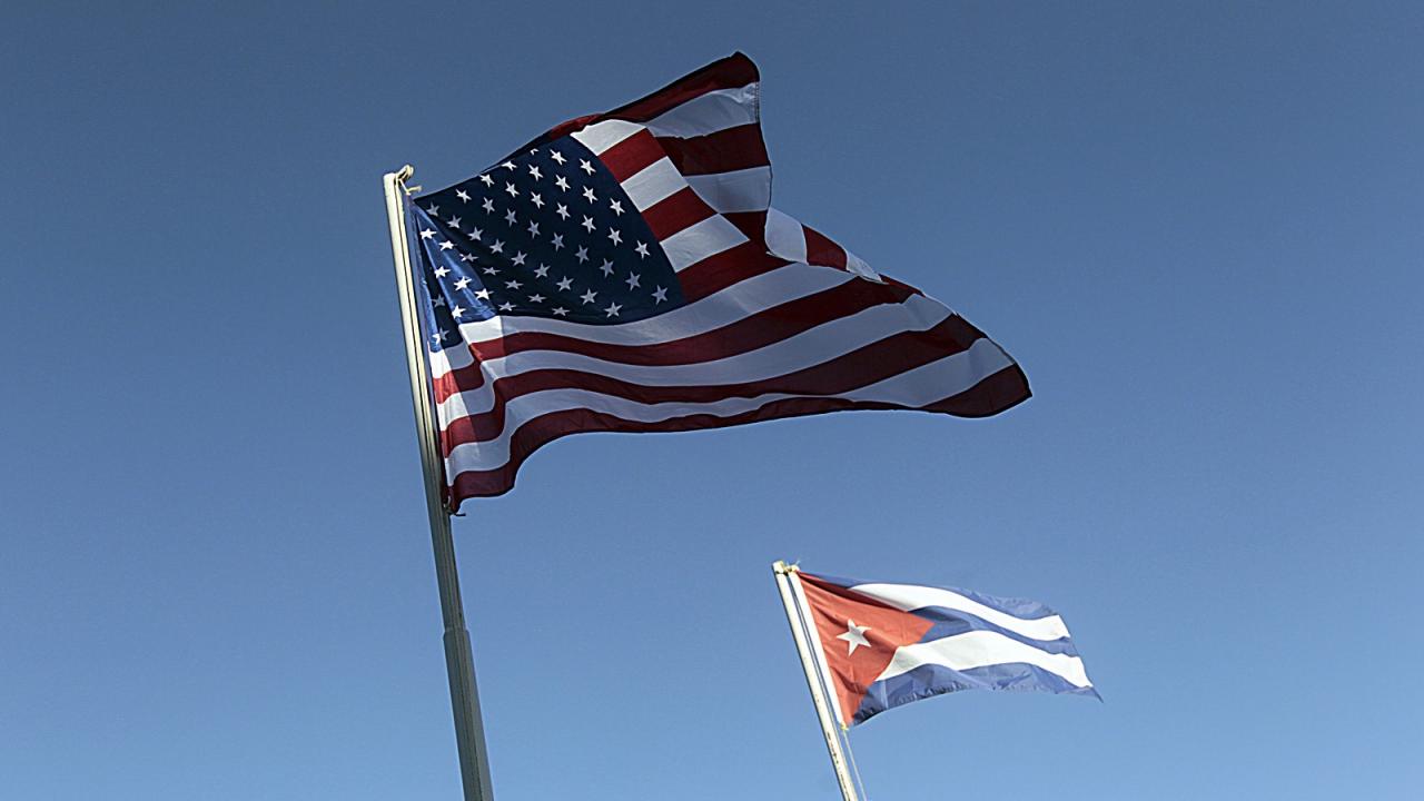 U.S. and Cuban flags.