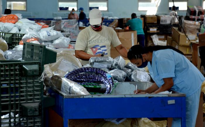 Package processing at a Cuban state-owned courier company.