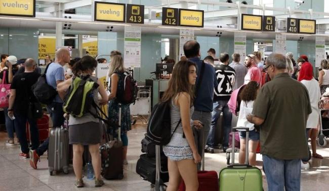 Personas en el aeropuerto El Prat de Barcelona.