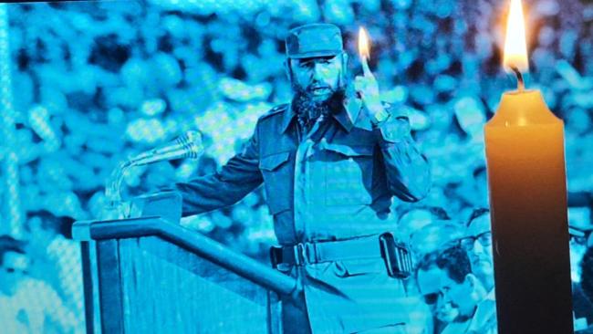 Imagen de Fidel Castro junto a una vela prendida en Cuba.