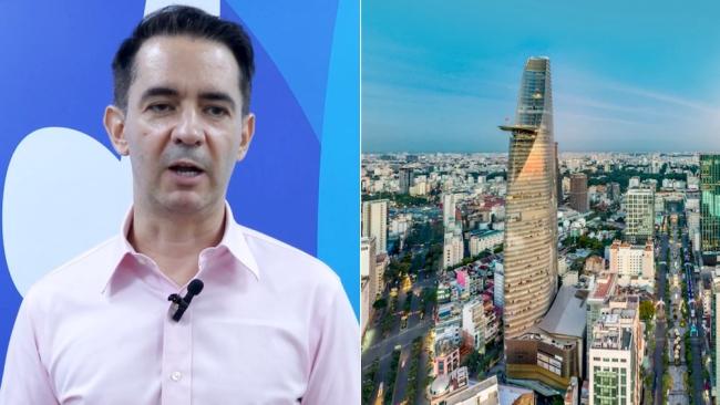 El economista cubano Pável Vidal y una imagen de ciudad Ho Chi Minh, antigua Saigón.