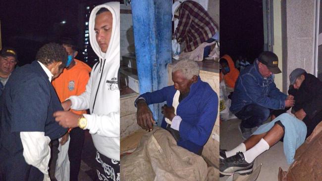 Miembros de la Comunidad de San't Egidio reparten abrigos a personas sin hogar en Santiago de Cuba.